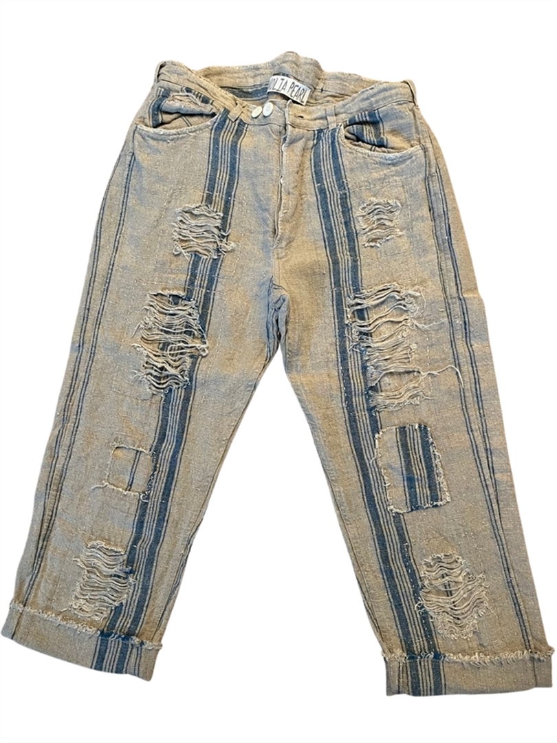 Distressed beige pants with blue striping